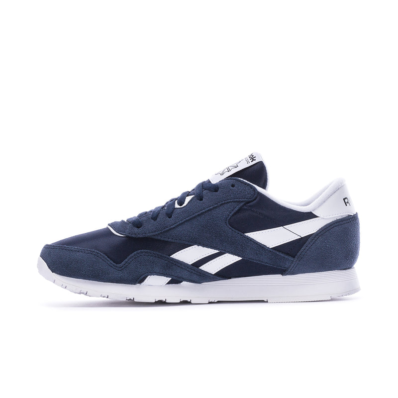 Men's navy low-top sneakers with white stripe panels and lace-up, side angle view.