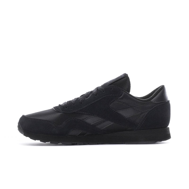 Men's black Reebok low-top lace-up sneakers, angled side view
