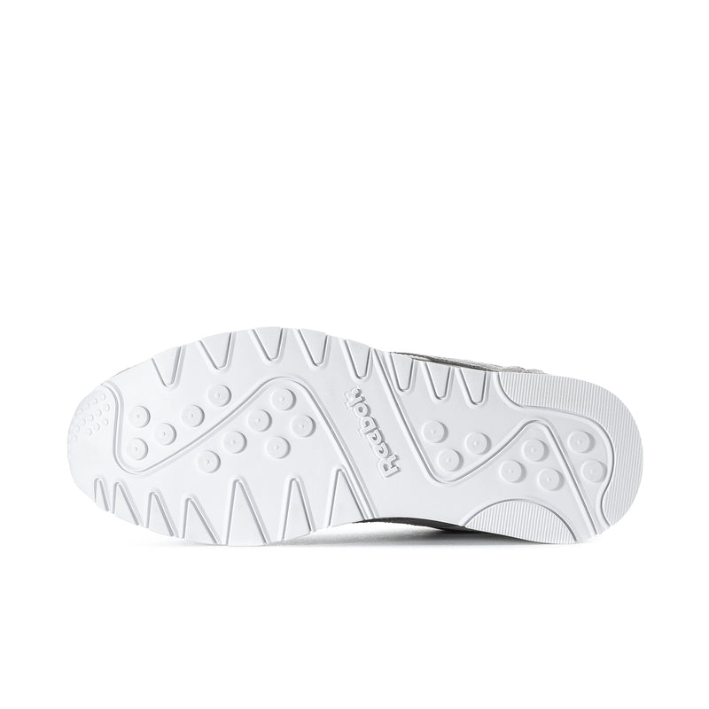 Men's Reebok sneaker outsole, white tread with circular grip pads