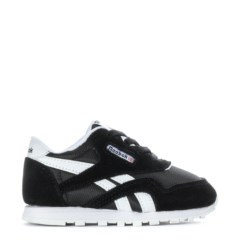Toddler black and white Reebok sneakers with lace-up front and side stripes