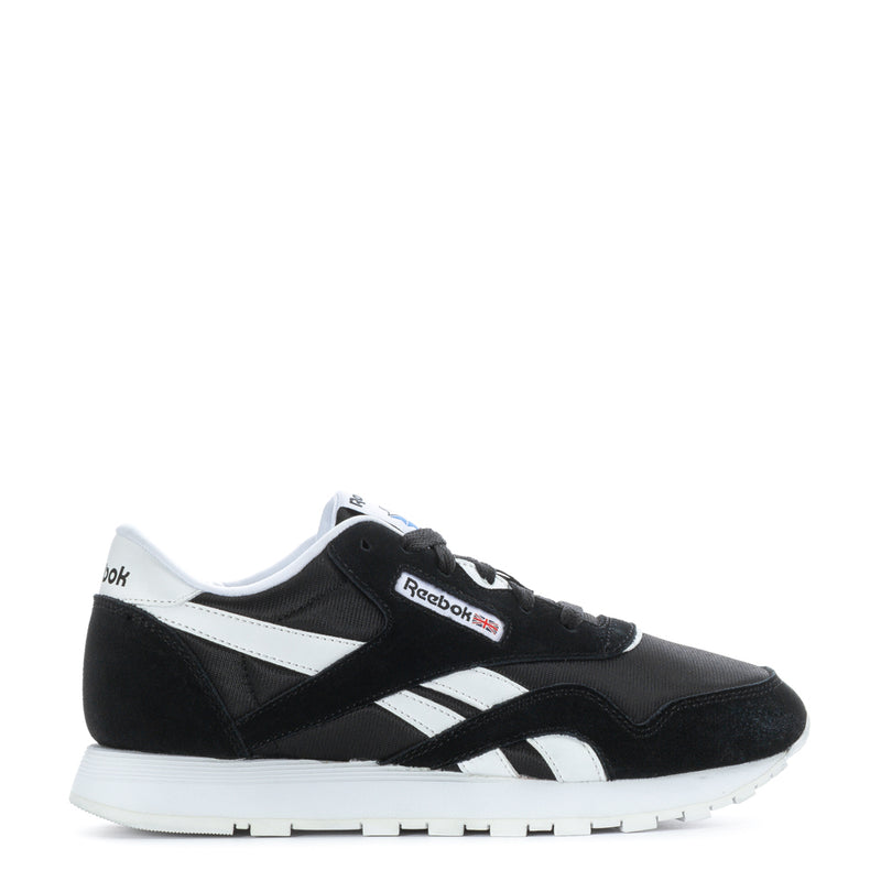 Reebok youth black-and-white low sneakers with side stripes and white sole