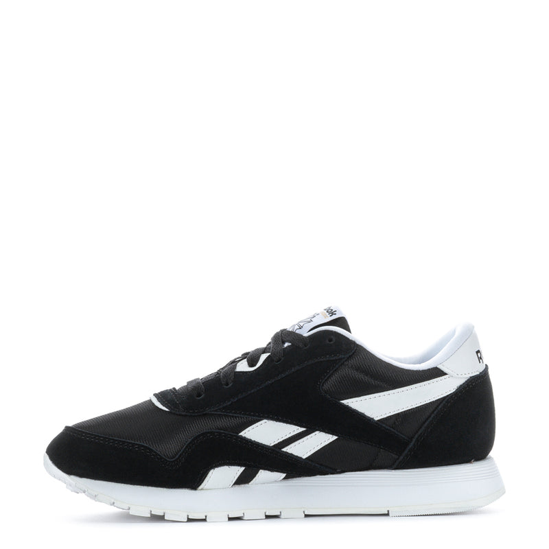 Reebok youth black low sneakers with white stripes and lace-up front