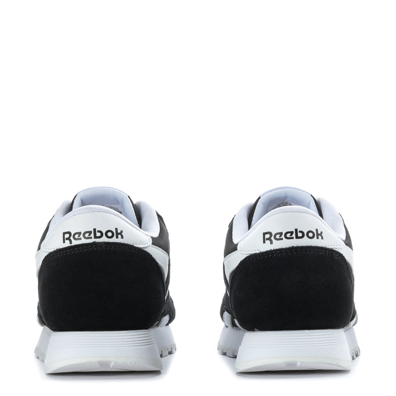 Reebok youth sneakers heel view in black with white accents and logo