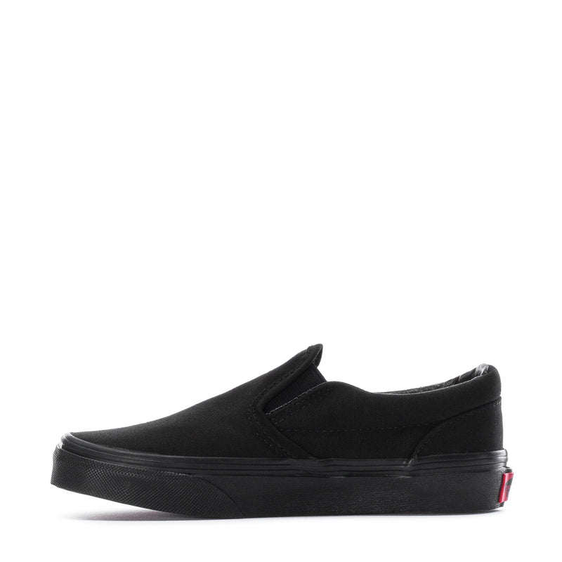 Black kids slip-on sneaker with side strap tab and low-profile rubber sole
