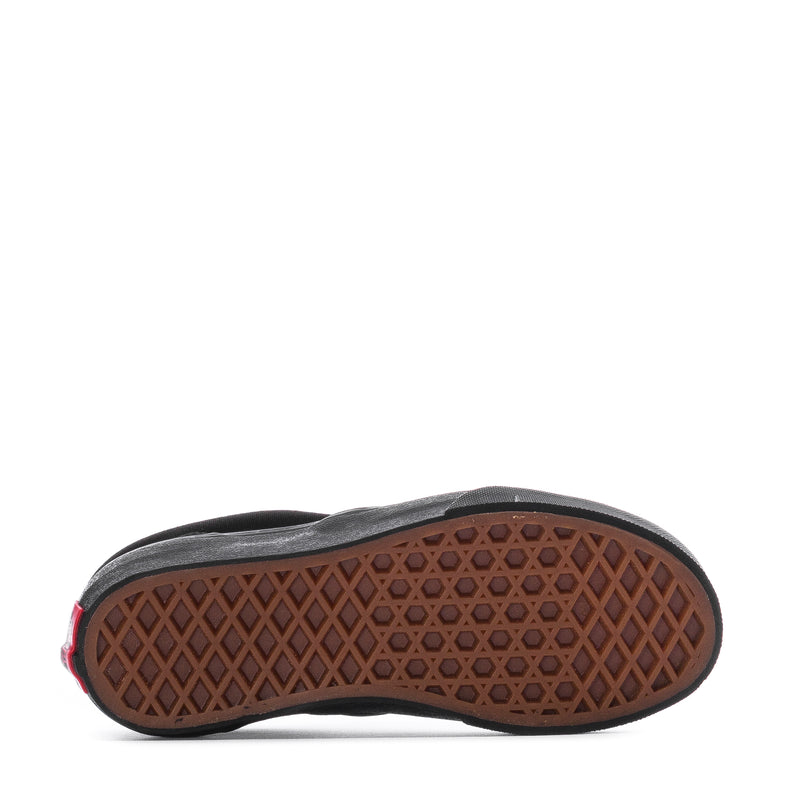 Kids slip-on sneaker outsole with brown gum tread pattern and black midsole