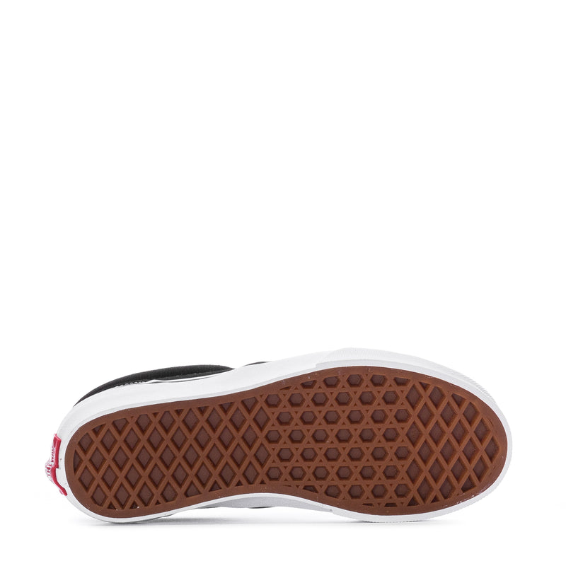 Kids slip-on sneaker outsole with brown tread and white sidewall