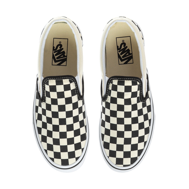 Vans slip-on shoes with black and white checkerboard canvas and logo in the insole
