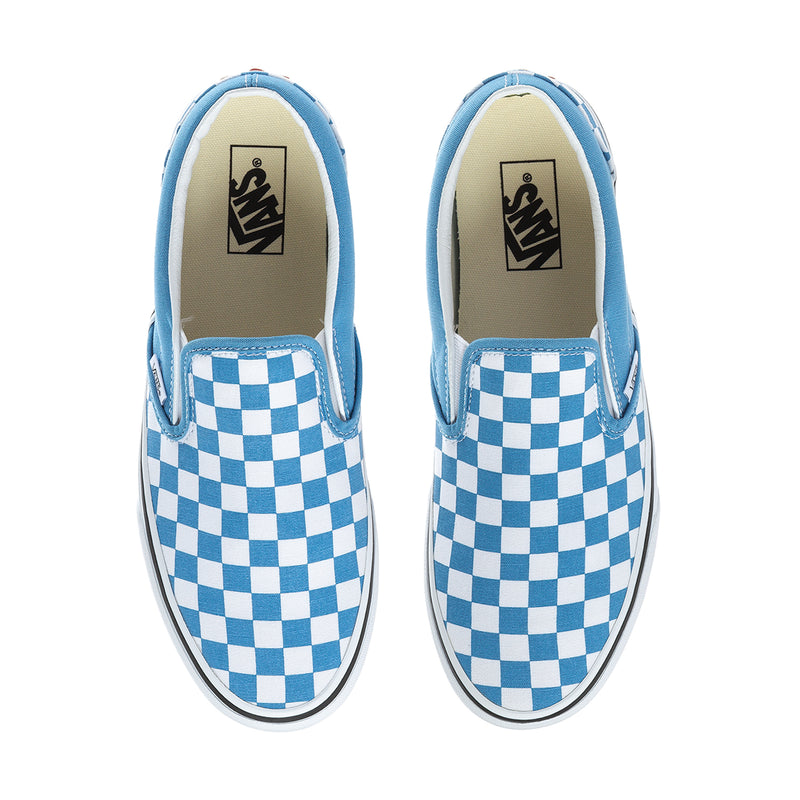 Mens slip-on sneakers with blue checkerboard sides and Vans logo on tongue