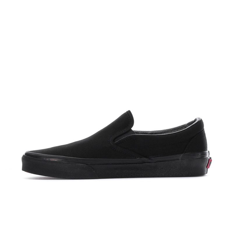 Black slip-on sneakers side view with elastic gore and low rubber sole
