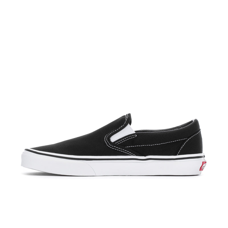 Vans men's classic slip-on sneakers, black canvas side goring panels and white sole.