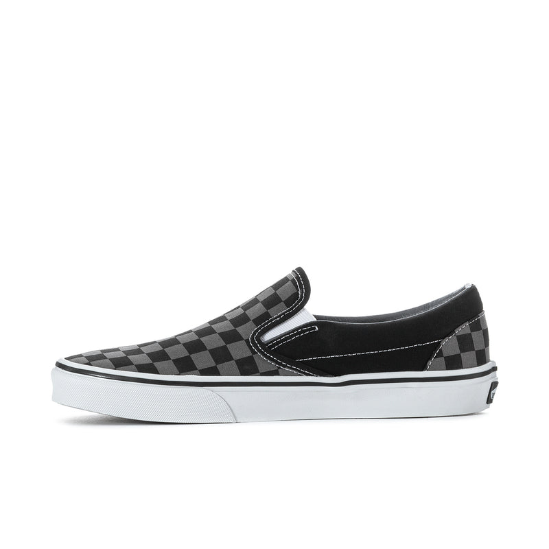 Black checkerboard slip-on sneakers with white sidewall and low-profile sole