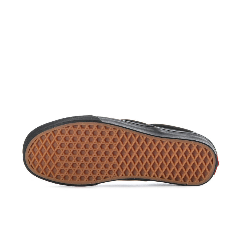 Black outsole underside with gum tread pattern for Vans slip-on sneakers