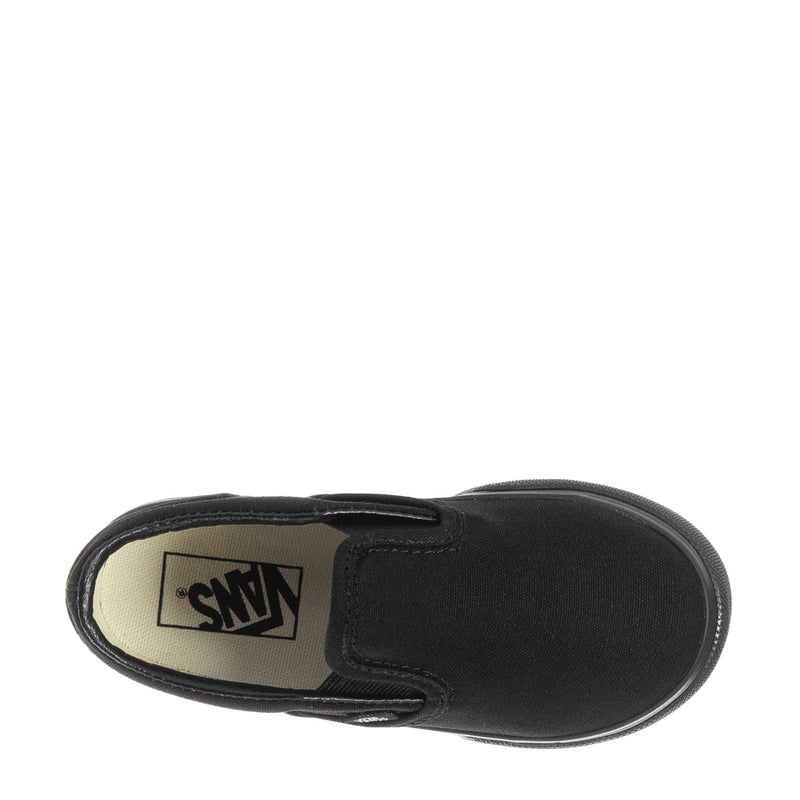 Black toddler slip-on sneakers with insole label showing Vans logo