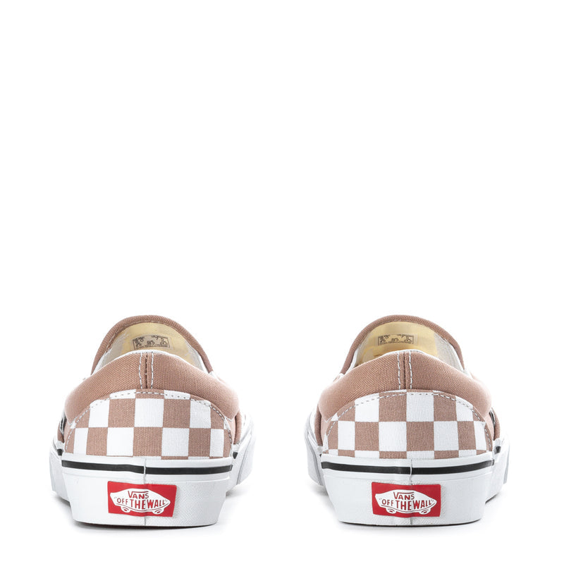 Women's slip-on sneaker back view with checkerboard heel and Vans branding
