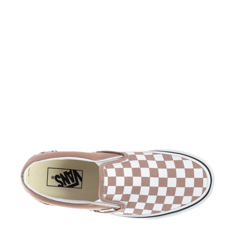 Women's slip-on sneaker interior view with warm taupe lining and checkerboard upper