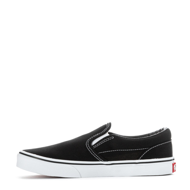 Youth black slip-on sneaker with white sidewall stripe and low-profile sole