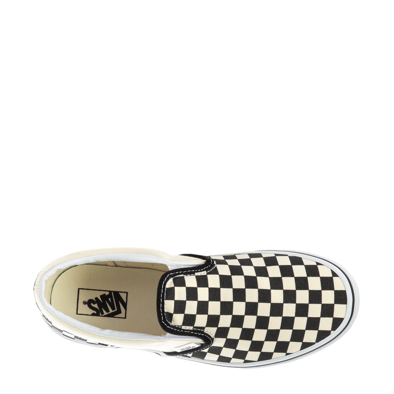 Youth slip-on sneaker showing interior lining and Vans logo, black-and-white checkerboard