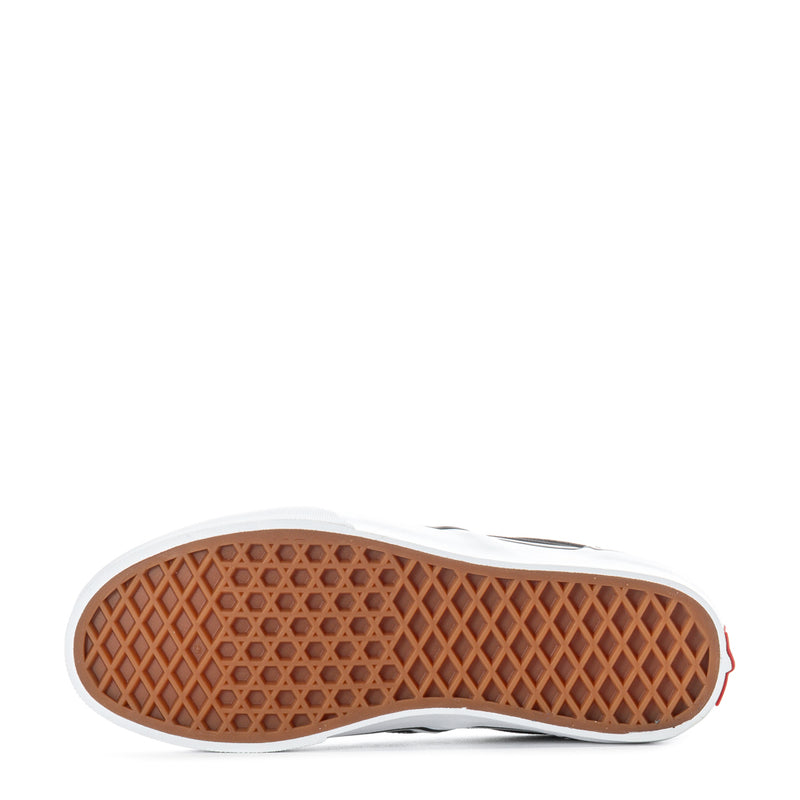 Youth Vans slip-on outsole with tan waffle tread and white rubber edge