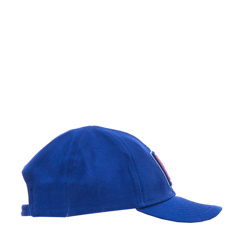 Infant blue baseball cap, side view with small red logo tag