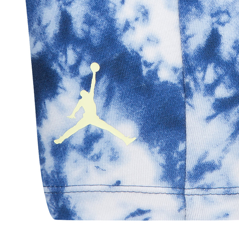 Kids tie-dye bike shorts in blue with yellow Jumpman logo on the front