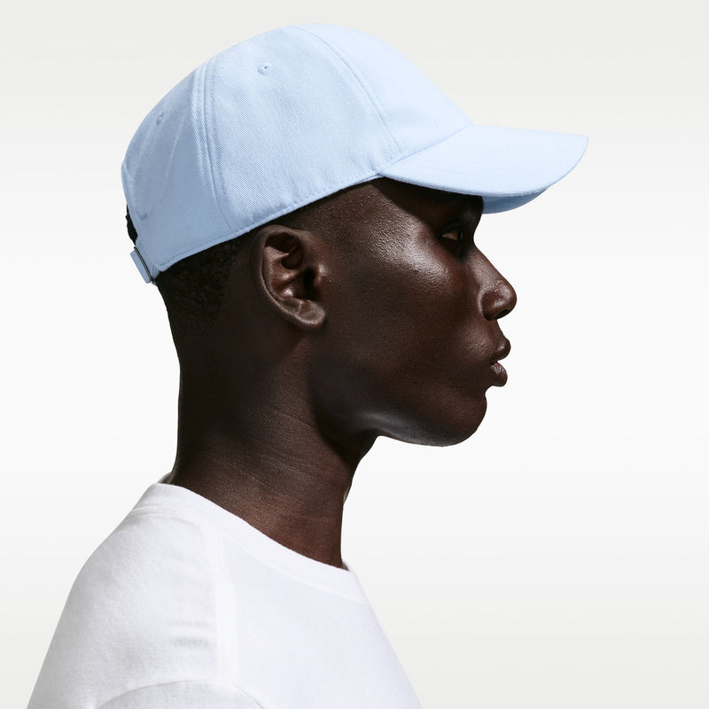 Light blue Nike strapback cap, side profile with curved brim