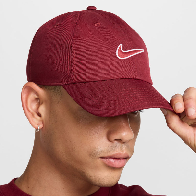 Maroon Nike cap with white Swoosh logo on side panel