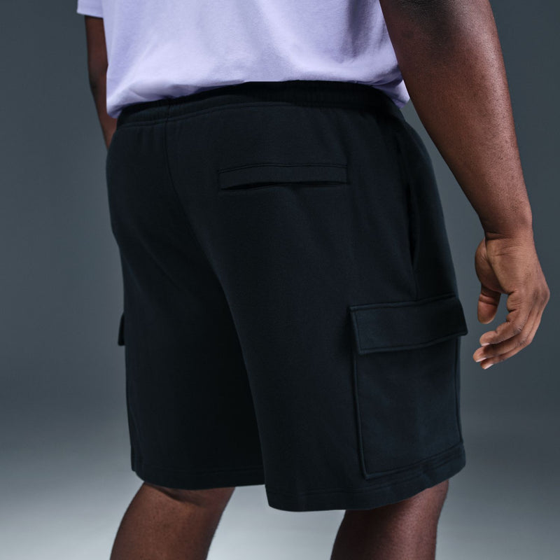Men's black cargo shorts side view with large pocket panel and elastic waist