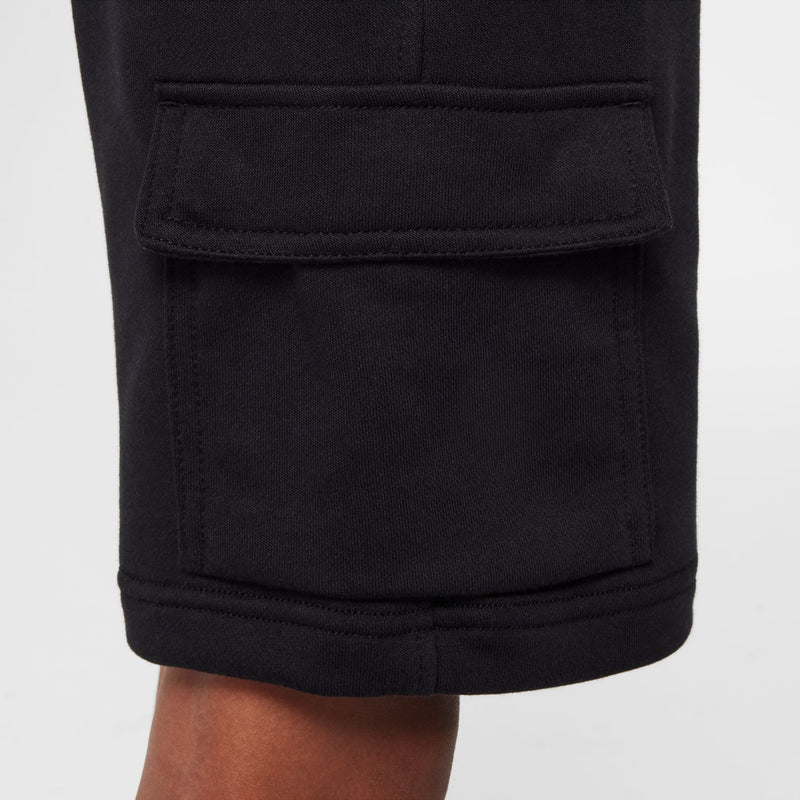 Youth black cargo shorts close-up of front cargo pocket and stitched hem