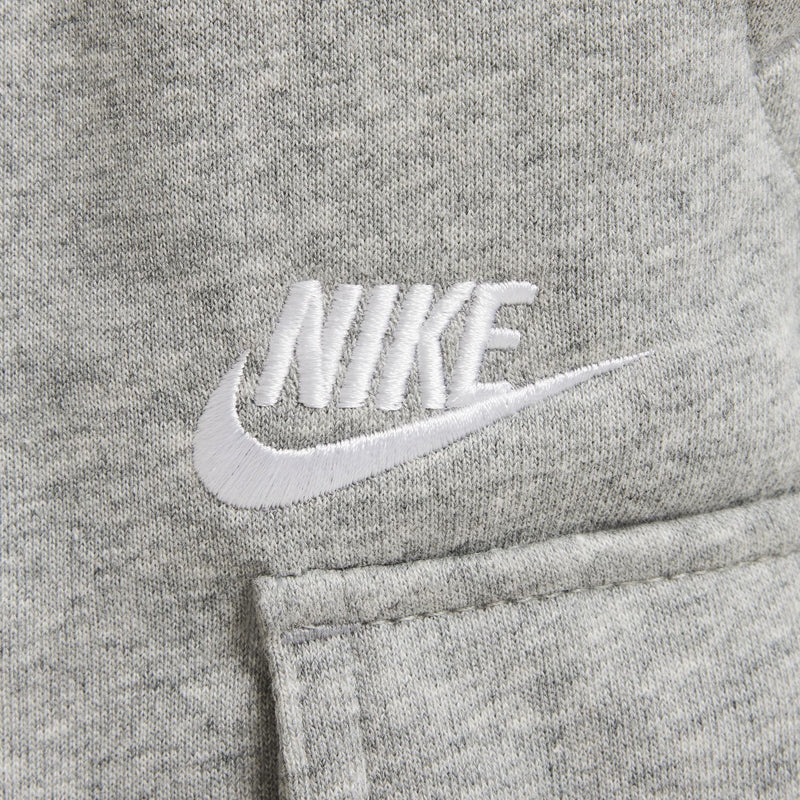 Close-up of youth dark grey heather shorts with white Nike logo