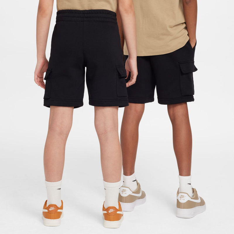 Youth black cargo shorts with side cargo pockets, worn with white crew socks