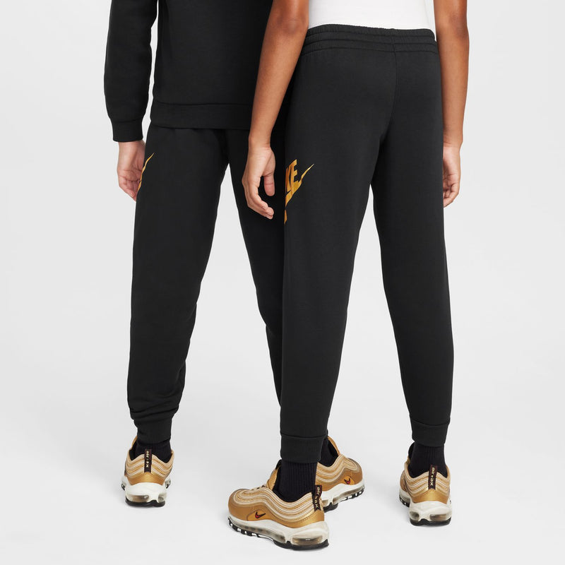 Youth black joggers with small gold NIKE logo on leg