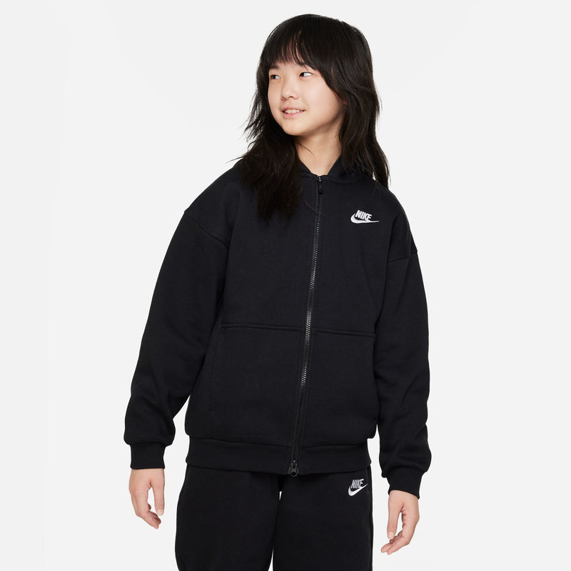 Youth black full-zip fleece hoodie on model, front with hood and Nike chest logo
