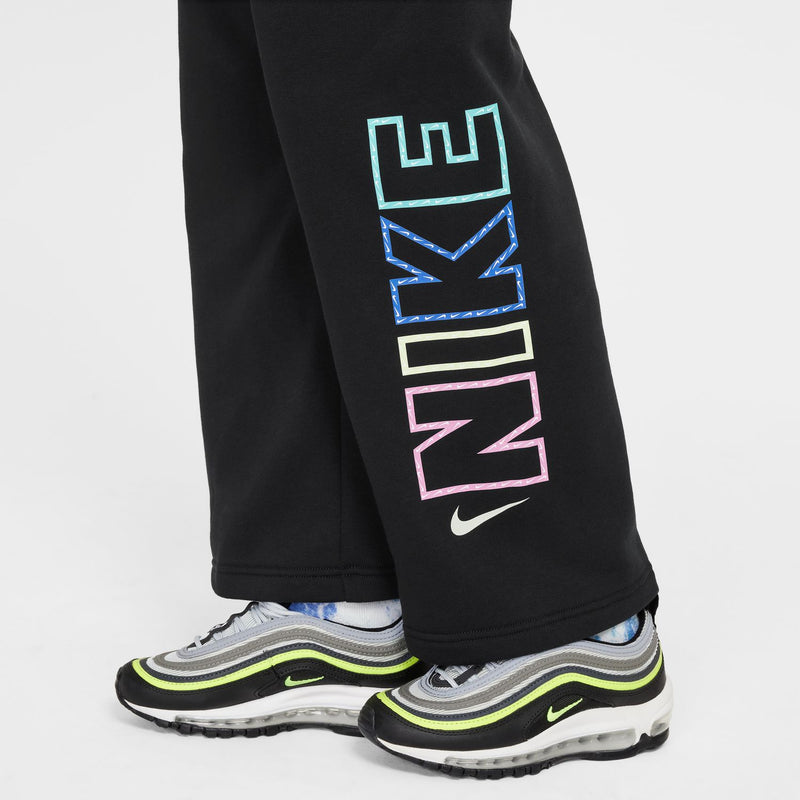 Black fleece pants with large multicolor NIKE logo graphic on lower leg