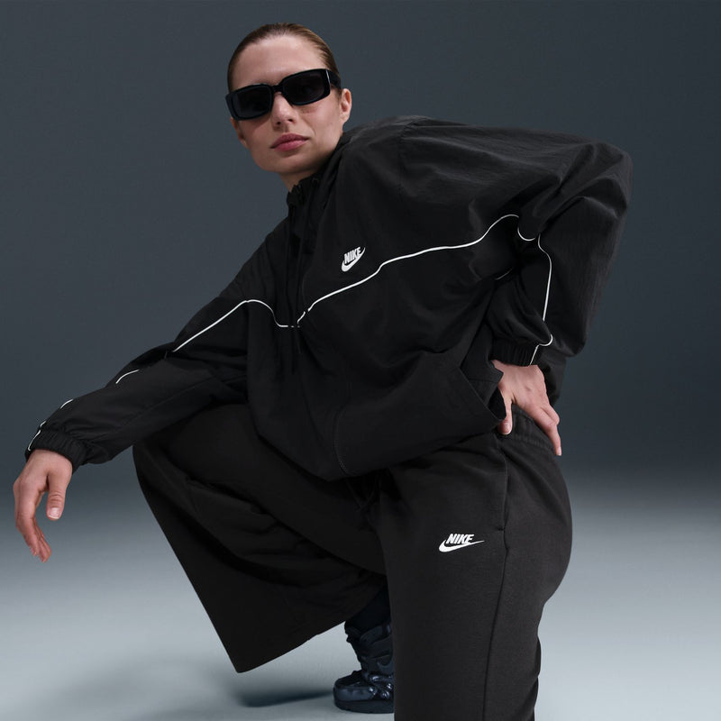 Women's black wide-leg fleece pants with elastic waist and Nike logo