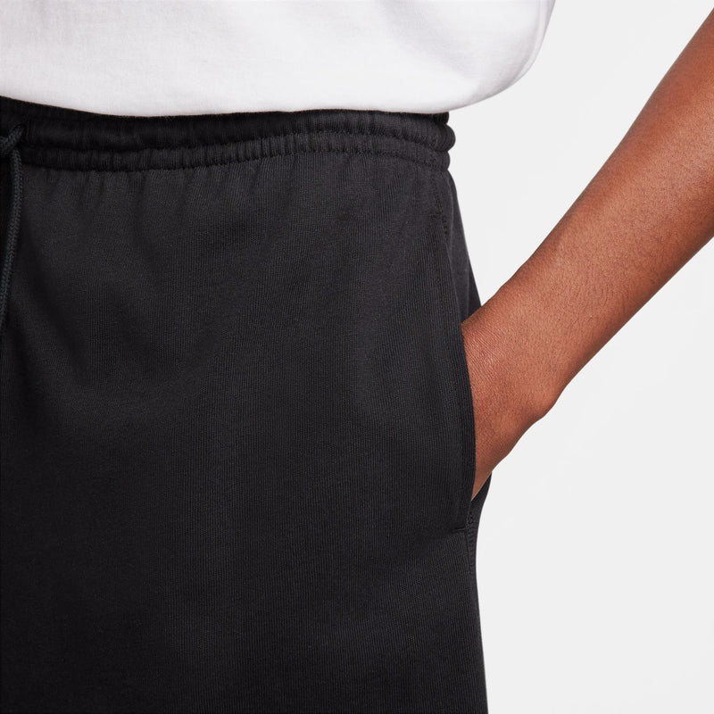 Men's black shorts fabric texture with elastic waistband and drawstring