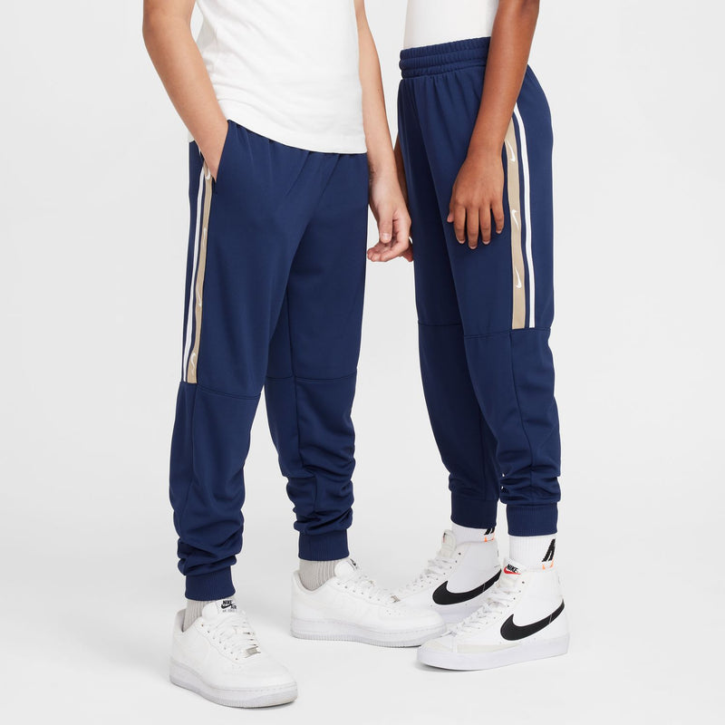 Youth navy poly joggers with side stripe panels and ribbed ankle cuffs.