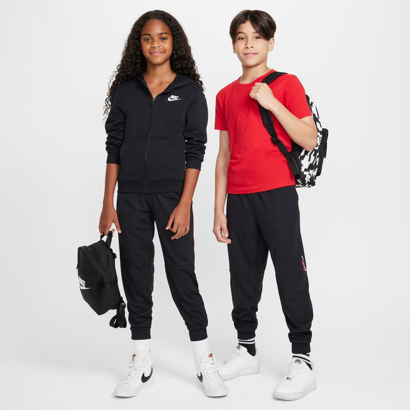 Youth black zip-up style tracksuit jogger with white sneakers and cuffs
