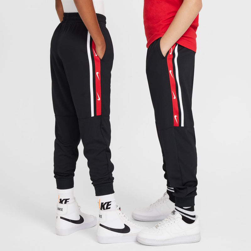 Youth black jogger pants with vertical side stripe panel in red and white