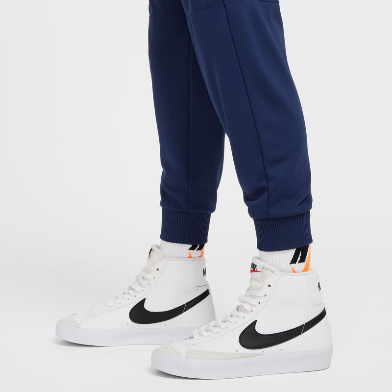 Youth navy joggers showing ribbed cuffs and clean tapered leg openings.