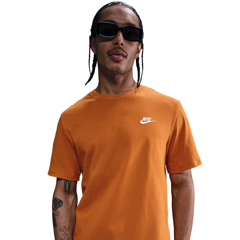 Men's orange crewneck T-shirt, Nike logo on chest; worn by model.