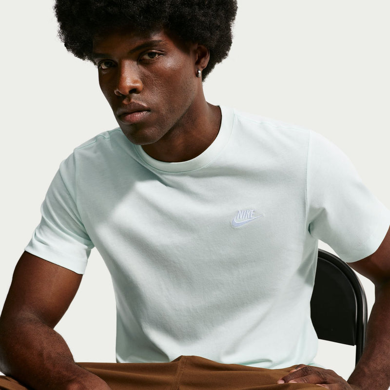 Light mint green club T-shirt with crew neck and small Nike logo, model close-up