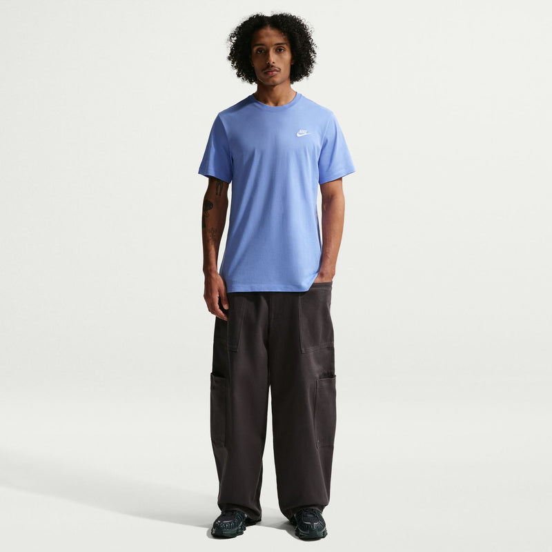 Men's light-blue crewneck tee with Nike logo, on model