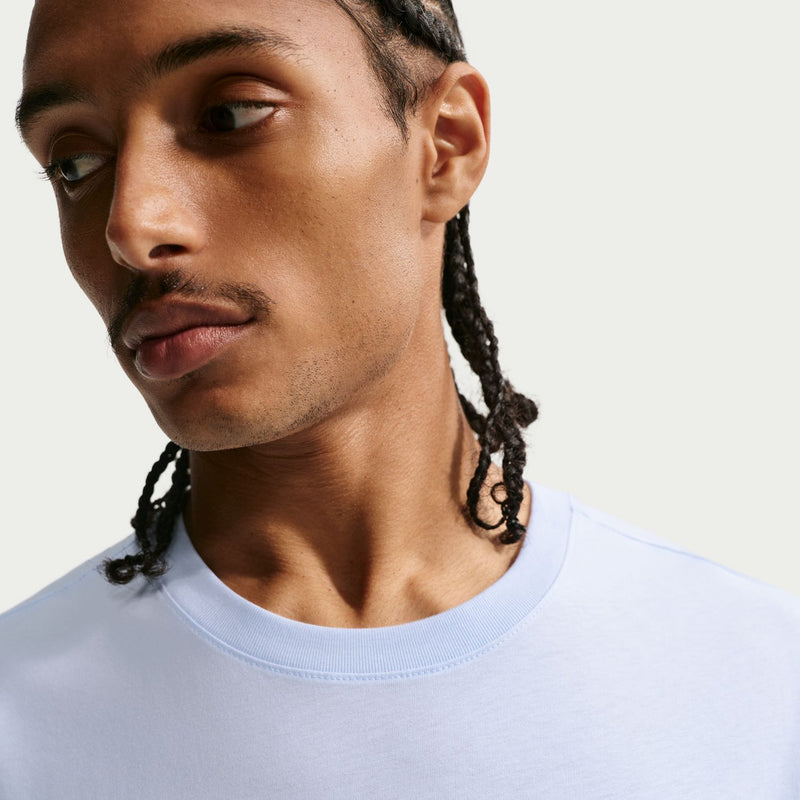 Men's light blue crewneck T-shirt neckline close-up