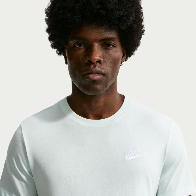 Mint green club T-shirt with crew neck and small Nike logo, close-up chest view