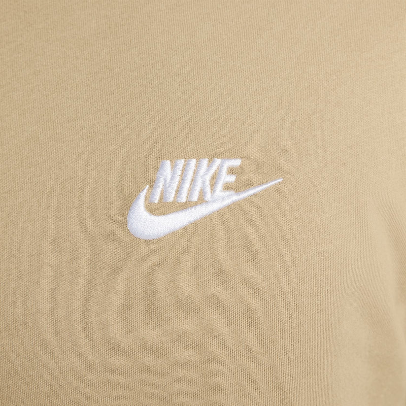 White Nike logo on beige crew-neck club tee fabric
