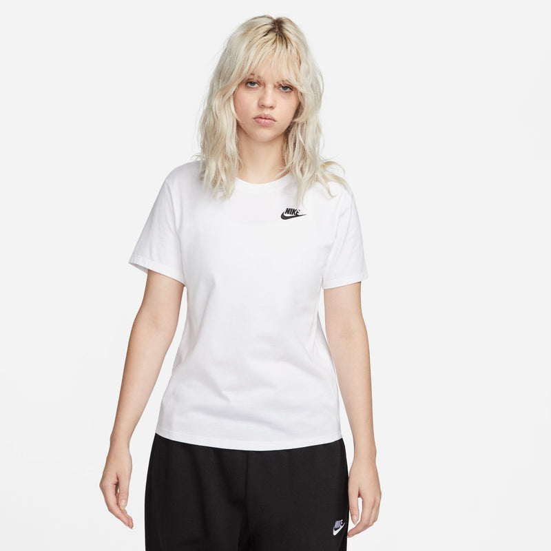 Women's white Nike T-shirt on model, crew neck, black logo at left chest