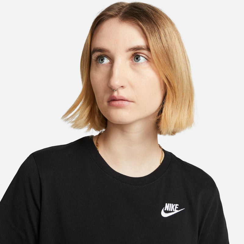 Black crewneck tee with small white Nike logo on left chest, close-up