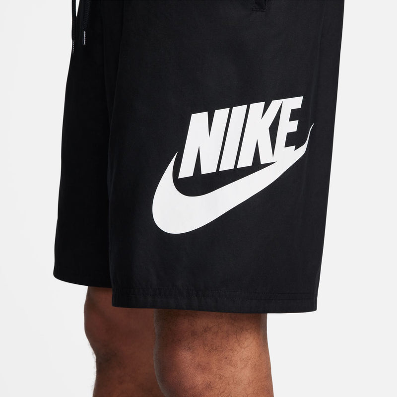 Men's black woven shorts with large white Nike swoosh logo on leg