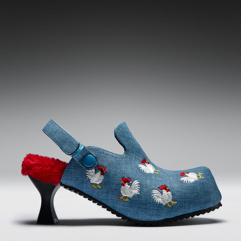 Blue clogs with chicken embroidery on a gray background