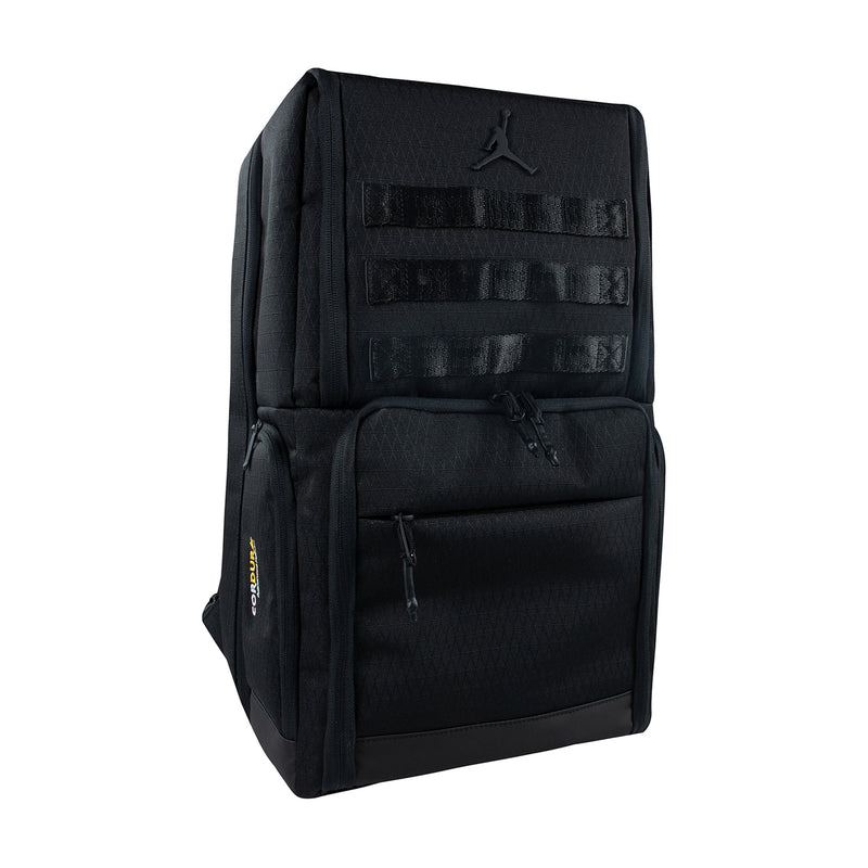 Black backpack with front patch panels and top logo badge